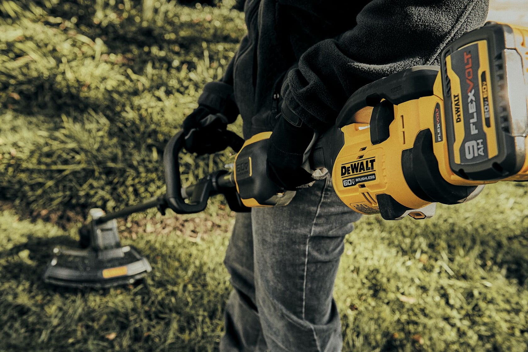close up of Brushless Attachment String Trimmer being used outside.