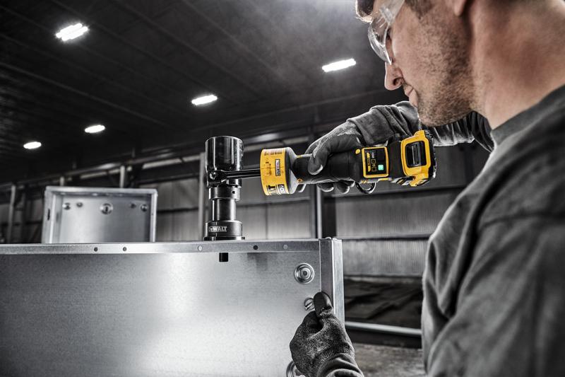 DEWALT Knockout Tool is used to punch a hole in an electrical box in a pre fabrication shop.