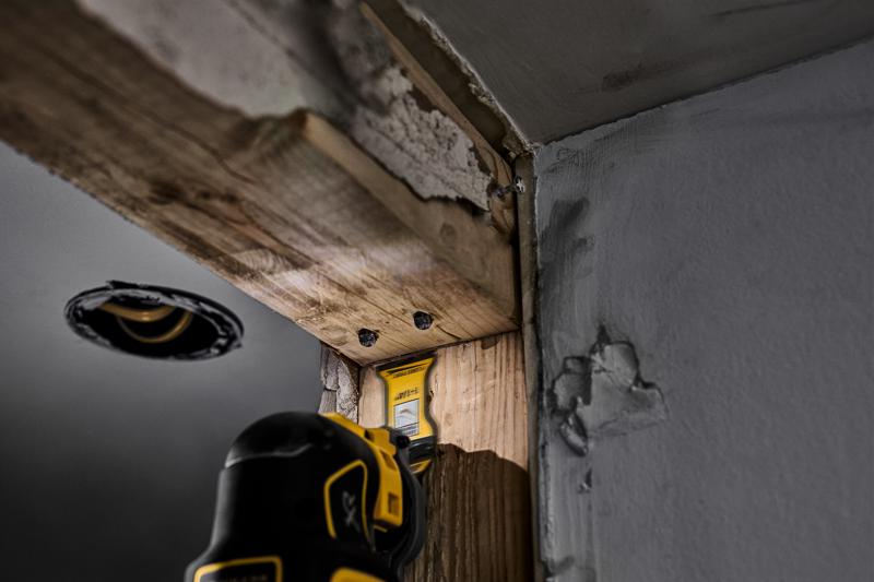 DEWALT Oscillating blade cutting nails through wood