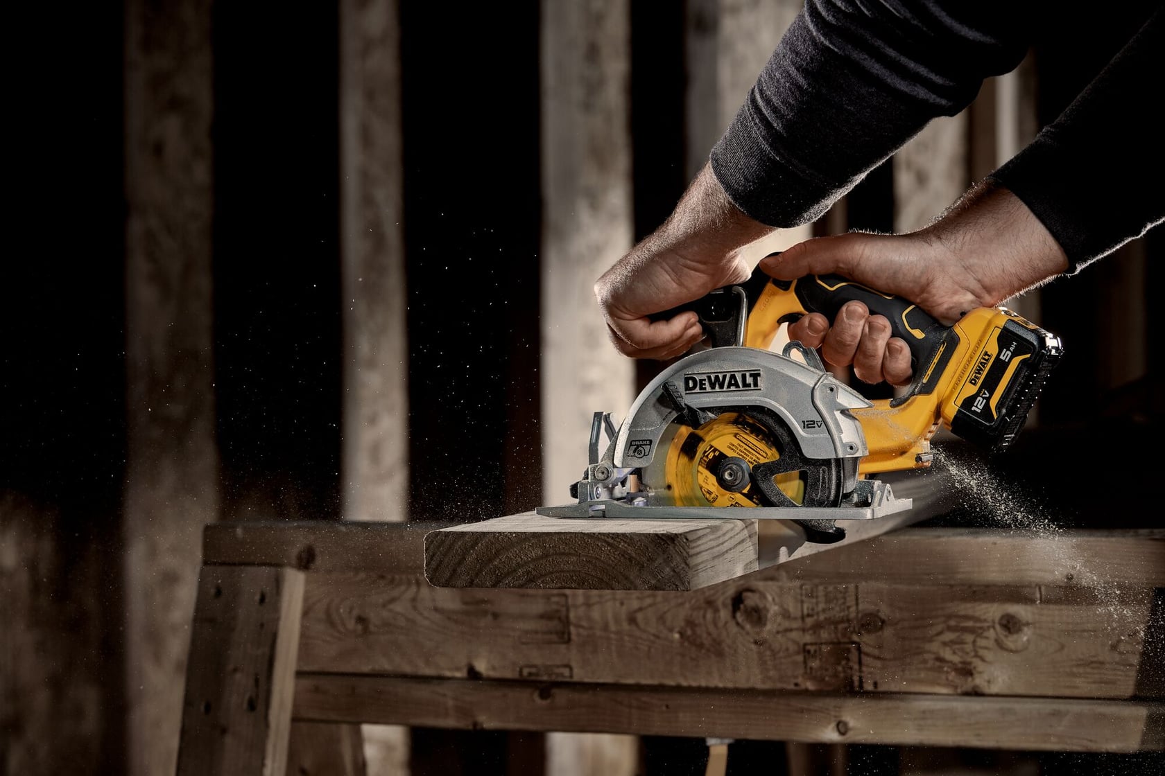 Xtreme 12 volt 5 and three eighths inch brushless cordless circular saw tool being used to cut wood.