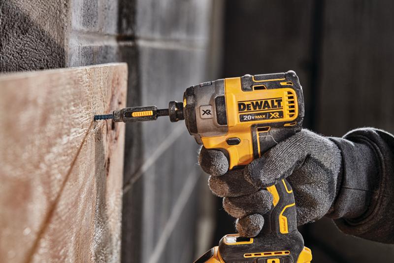 XR 3-speed impact driver fastening screw through wood on concrete.